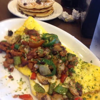 The Pancakery - Jalapeño super spicy omelette! Pancakes w/ choc chips, bananas and strawberries. - Breakfast & Brunch Near Me - Destin, Florida The Pancakery - Jalapeño super spicy omelette! Pancakes w/ choc chips, bananas and strawberries. - Breakfast & Brunch Near Me - Destin, Florida