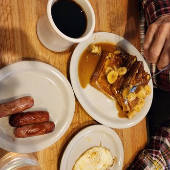 Sunset Grill - Caramel Banana  French Toast! Husband added an egg over medium!! - American Near Me - Fredericksburg, Texas