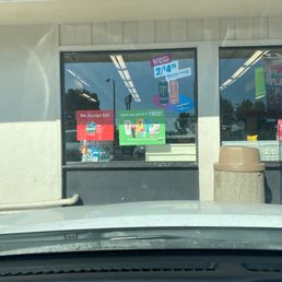 the front window of a convenience store