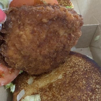 McDonald's - a fried chicken sandwich with lettuce and tomatoes - Fast Food Near Me - Seabrook, Maryland