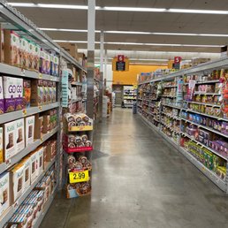 a grocery store aisle filled with food a grocery store aisle filled with food