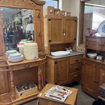 That Old Thing - Wooden cabinets, a mirror, and a small table with magazines are arranged in an antique store setting. - Used, Vintage & Consignment Near Me - Tehachapi, California