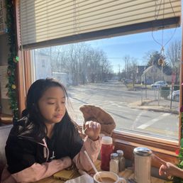 My daughter drinking her hot chocolate.
