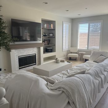 Level Up Restoration - Living area makeover with fireplace update, custom shelf inserts, paint, flooring, baseboards - Flooring Near Me