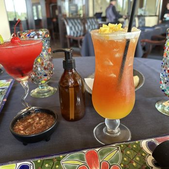 Sol y Luna - a table with drinks and condiments - Mexican Near Me - Bakersfield, California Sol y Luna - a table with drinks and condiments - Mexican Near Me - Bakersfield, California