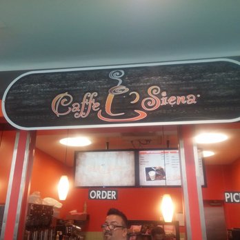 Caffe Siena - a man standing in front of a coffee shop - Coffee & Tea Near Me - Fort Lauderdale, Florida Caffe Siena - a man standing in front of a coffee shop - Coffee & Tea Near Me - Fort Lauderdale, Florida