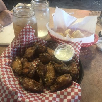 Squealer's - Delicious parmesan garlic wings smoked then marinated and fries along with house fried pork skins with ranch dressing for dipping. - Barbeque Near Me - Meridian, Mississippi