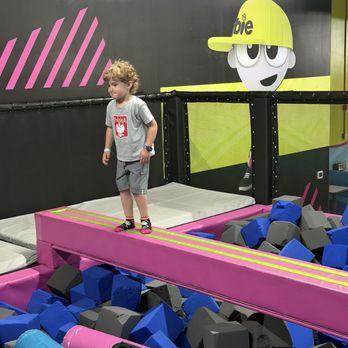 Urban Air Trampoline and Adventure Park - Balancing on the beam and jumping into the foam pit - Trampoline Parks Near Me - Glenview, Illinois Urban Air Trampoline and Adventure Park - Balancing on the beam and jumping into the foam pit - Trampoline Parks Near Me - Glenview, Illinois