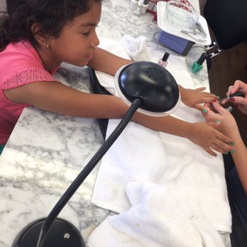 Nailpolish - She first picked glitter but she needed a solid color for the bottom and then glitter on top - Nail Salons Near Me - Long Beach, California