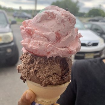 Four Boys Ice Cream - a person holding a cone of ice cream - Ice Cream & Frozen Yogurt Near Me - Jamesburg, New Jersey Four Boys Ice Cream - a person holding a cone of ice cream - Ice Cream & Frozen Yogurt Near Me - Jamesburg, New Jersey