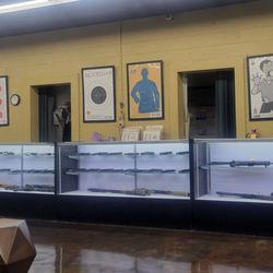 Quickshot Shooting Range - Front counter. You can rent any of the displayed weapons.