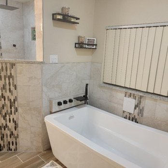 Tools On Wheels - a bathtub in a bathroom - General Contractors Near Me - Orlando, Florida Tools On Wheels - a bathtub in a bathroom - General Contractors Near Me - Orlando, Florida