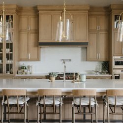 Down To Earth - White oak kitchen with barstools and accessories furnished by Down to Earth