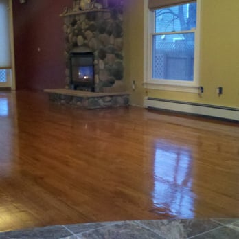 Northeastern Flooring & Construction - a living room with hard wood floors - Flooring Near Me Northeastern Flooring & Construction - a living room with hard wood floors - Flooring Near Me