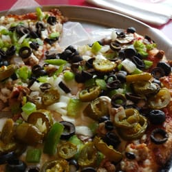 Gino's Pizza & Spaghetti House - Deluxe pizza Texas style with black olives and jalapeño