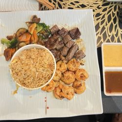 Mizu Japanese Steakhouse - Steak and shrimp combo served with veggies (very flavorful) and rice.