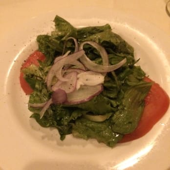 Girasole - Complimentary salad- Romiane lettus, tomatoes and onion seasoned in an olive oil dressing - Italian Near Me - Bound Brook, New Jersey