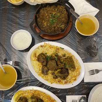 Sheba - Marq in the small bowls ,   Two big plates of Mandi GOAT - Middle Eastern Near Me - Houston, Texas