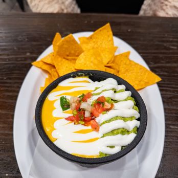 Mexicali Taco & Co - This is the half and half, queso and guacamole. Superb. - Mexican Near Me - Los Angeles, California