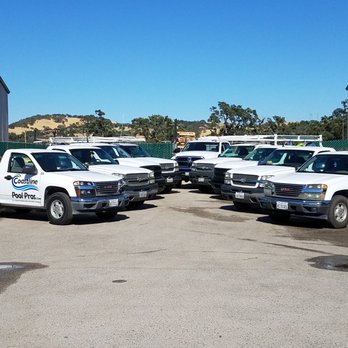 Coastline Pool Pros - a fleet of trucks parked in a lot - Pool Cleaners Near Me - Paso Robles, California Coastline Pool Pros - a fleet of trucks parked in a lot - Pool Cleaners Near Me - Paso Robles, California