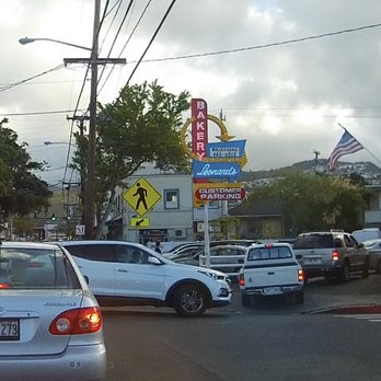 Leonard's Bakery - This is the usual traffic chaos outside Leonards. A long line of cars trying to get into the tiny parking lot, and blocking the street. - Bakeries Near Me - Honolulu, Hawaii