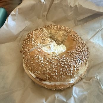 Lefty's Bagels - Sesame bagel with Garlic and Herb Cream cheese and bacon - Bagels Near Me - Chesterfield, Missouri