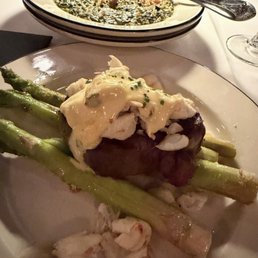 Perfectly-cooked medium-rare Wagyu Filet Oscar-Style with rich creamed spinach