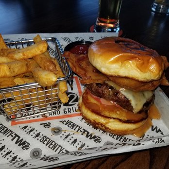 72 Tavern & Grill - Belly Burger $13 - 8 oz beef / bacon / pepper jack / onion rings / heirloom tomato / Kook’s special sauce😍😍😱 and FF - Sports Bars Near Me - Utica, New York 72 Tavern & Grill - Belly Burger $13 - 8 oz beef / bacon / pepper jack / onion rings / heirloom tomato / Kook’s special sauce😍😍😱 and FF - Sports Bars Near Me - Utica, New York