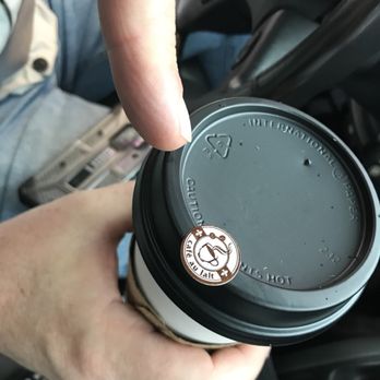 Mudslinger's Coffee - a hand holding a coffee cup - Coffee & Tea Near Me - Indianola, Iowa Mudslinger's Coffee - a hand holding a coffee cup - Coffee & Tea Near Me - Indianola, Iowa