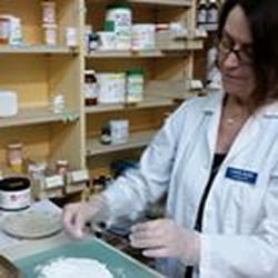 Compounding Pharmacist-In-Charge Laurie weighs capsules against a perfect master capsule to make sure they all come out exactly right!