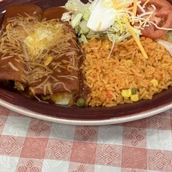Cinco De Mayo - 2 Enchiladas, one chicken, one beef with avocado, lettuce and sour cream topping.