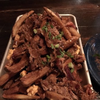 Dinosaur Bar-B-Que - 'Poutine' with pub cheese and pulled pork. Delicious, but we definitely missed the cheese curds. - Barbeque Near Me - Troy, New York
