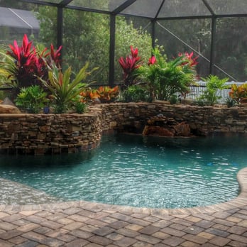 Pool Works - a view of a pool with a waterfall - Pool & Hot Tub Service Near Me - Parrish, Florida Pool Works - a view of a pool with a waterfall - Pool & Hot Tub Service Near Me - Parrish, Florida