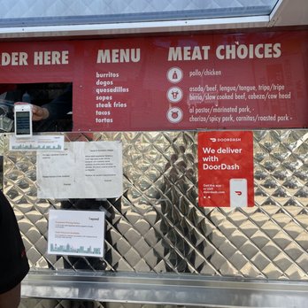 Tacos El Muchacho Alegre - a man standing in front of a food truck - Food Trucks Near Me - Napa, California