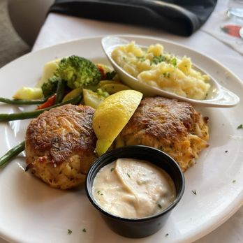 Sunset Grille - Crab cake entree with side of aioli,  seasonal vegetables and mashed potatoes - Seafood Near Me - Ocean City, Maryland