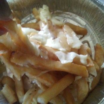 MC Pizza - a person taking a bite of french fries - Pizza Near Me - Harrisburg, Pennsylvania MC Pizza - a person taking a bite of french fries - Pizza Near Me - Harrisburg, Pennsylvania