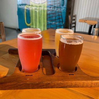 Two Weeks Notice Brewing - three beers on a wooden tray - Breweries Near Me - West Springfield, Massachusetts Two Weeks Notice Brewing - three beers on a wooden tray - Breweries Near Me - West Springfield, Massachusetts