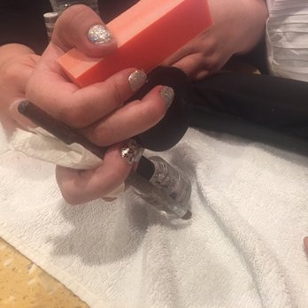 Riley's Nails & Spa - Some ingenuity from the staff to keep her hand from closing and ruining the rest of her nails - Waxing Near Me - Tempe, Arizona