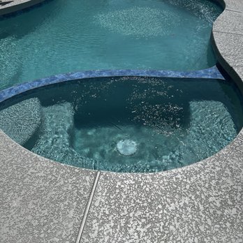 Exclusive Pools - Picture of pool when Tile, pebble & Decking was completed. - Pool & Hot Tub Service Near Me