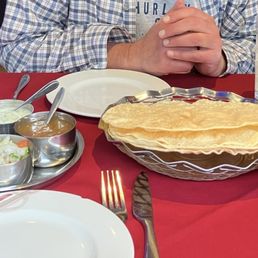 mango lassi, papadam and a chutney tray. mango lassi, papadam and a chutney tray.