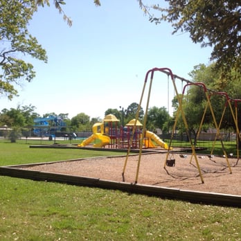 Rex Meador Park - Playground with swings, also can see pool slides in the left corner - Parks Near Me - Seabrook, Texas Rex Meador Park - Playground with swings, also can see pool slides in the left corner - Parks Near Me - Seabrook, Texas
