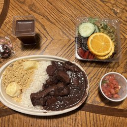 A chocolate truffle, chocolate mousse, and their Feijoada dish (comes with salad and pico on the side)