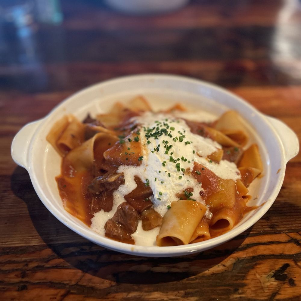 Oenotri - PAPPARDELLE WITH SHORT RIB SUGO, GARLIC, ONION, TOMATO AND HORSERADISH CREMA - Italian Near Me - Napa, California Oenotri - PAPPARDELLE WITH SHORT RIB SUGO, GARLIC, ONION, TOMATO AND HORSERADISH CREMA - Italian Near Me - Napa, California