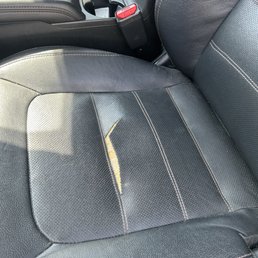 Two torn ripped front seats. Two torn ripped front seats.