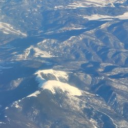 Travel By TJ - Cruise Planners - Flying over the rockies