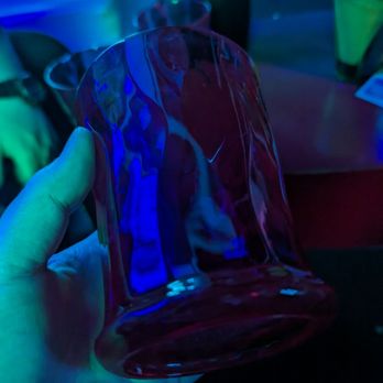 Sage Restaurant & Lounge - a hand holding a blue glass - Lounges Near Me - Whittier, California Sage Restaurant & Lounge - a hand holding a blue glass - Lounges Near Me - Whittier, California
