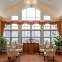 Saint Therese at St. Mary of the Woods - Residents gather in the light-filled sitting room, with its vaulted ceiling and arched window.
