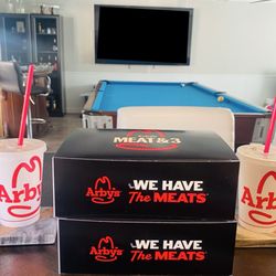 Arby's - Value combo $7.99 (as of Jan 2026) including a main entrée, a small fry, two mozzarella sticks, a peach cobbler roll, and a small drink