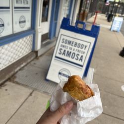 Dean's Mediterreanean Imports - Samosa with sign outside