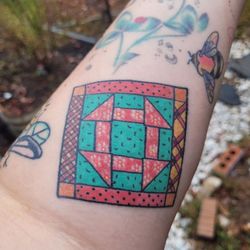 Ink & Dagger Tattoo - This is a custom tattoo to represent my love of quilting. You can also see another of her bees in the upper right.